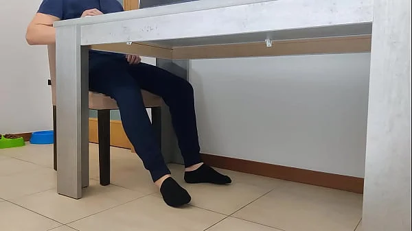 giving handjob under the table